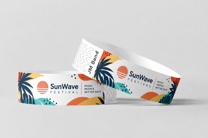 Dos pulseras de papel con estampado de festival al atardecer a todo color