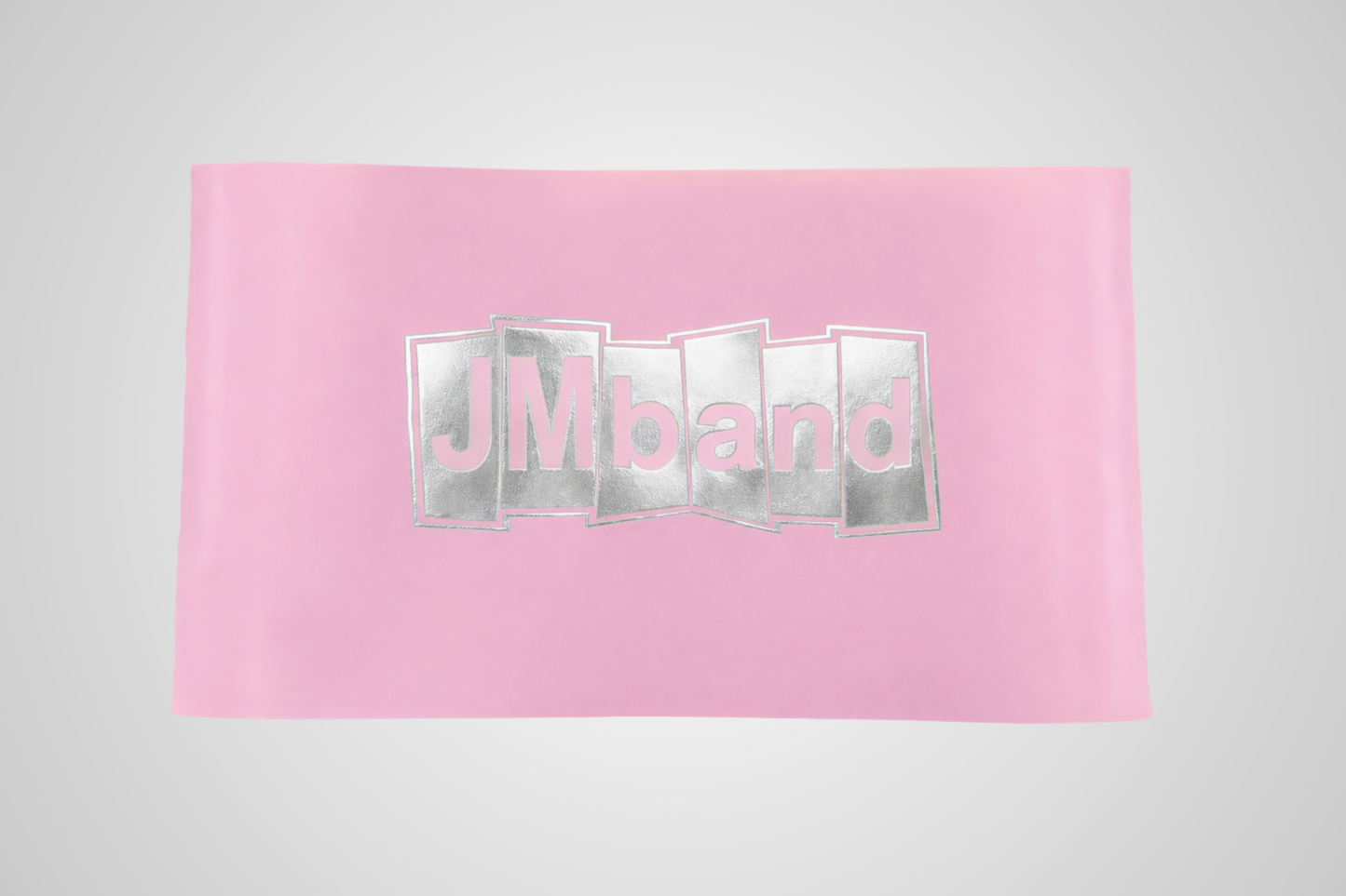 Imagen de una cinta rosa con impresión en lámina térmica plateada de JM Band®.